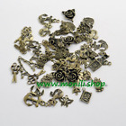 Lotto 150 ciondoli charms, tono bronzo antico