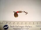 Old fishing lure. Small revolving spinner.