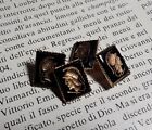 Gemelli vintage "Centurione",anni 60, nero e oro, metallo e vetro, 1,1 x 1,3 cm.