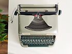 Green-olive Erika Model 12 a portable working vintage typewriter from the 1950S